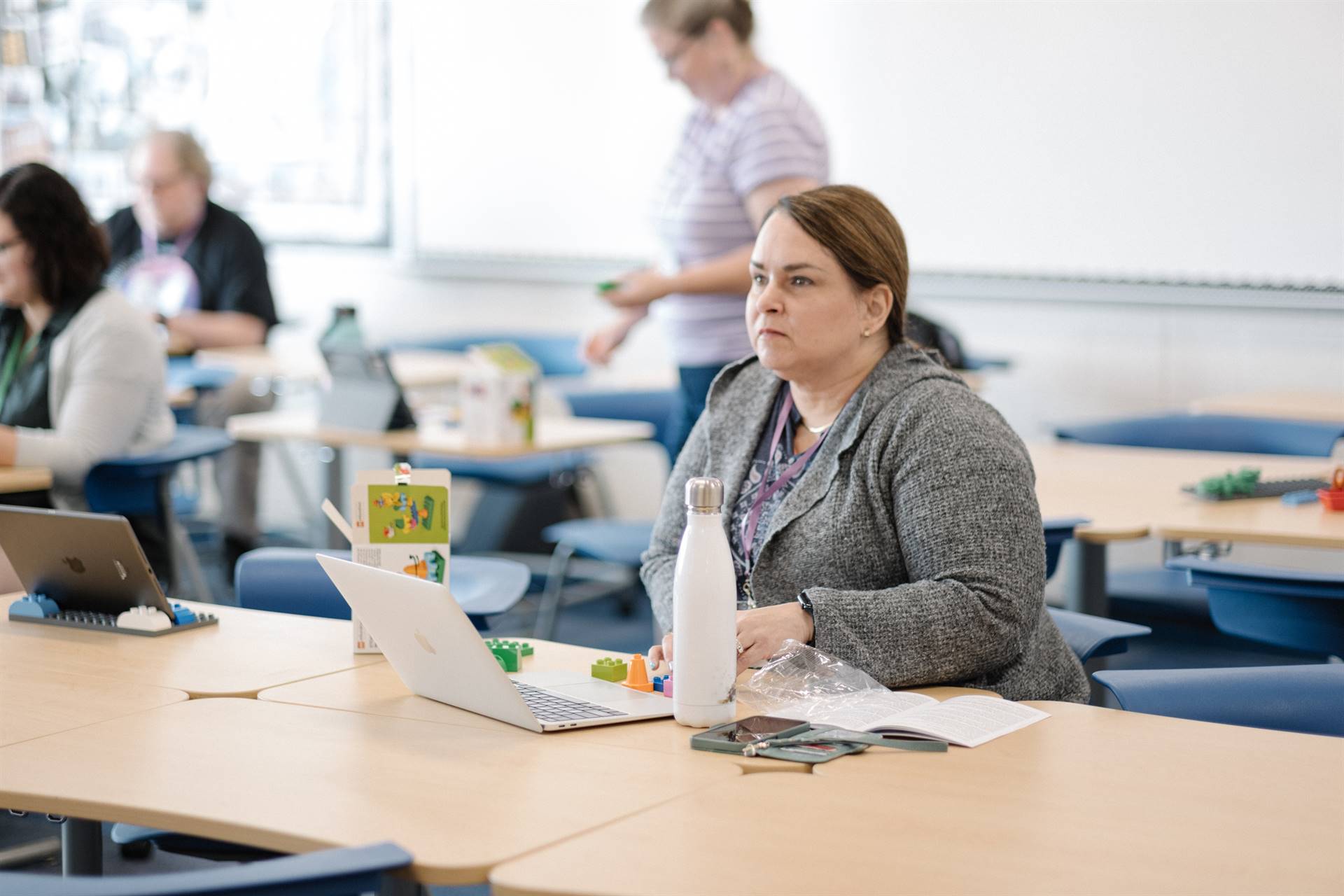 Attendee listens to presentation